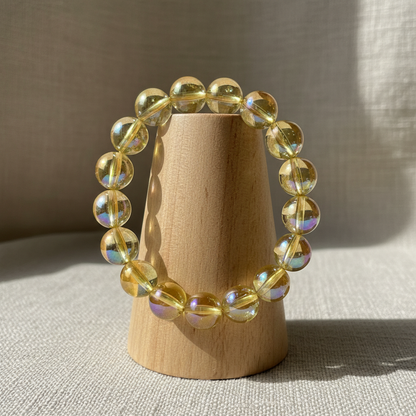 Yellow citrine bracelet on wood cylinder stand